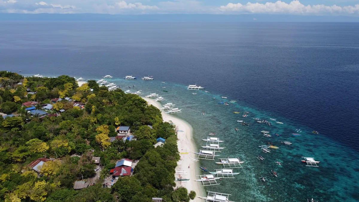 Aerial view of white sand and turquoise shallows on Panglao Island, Bohol